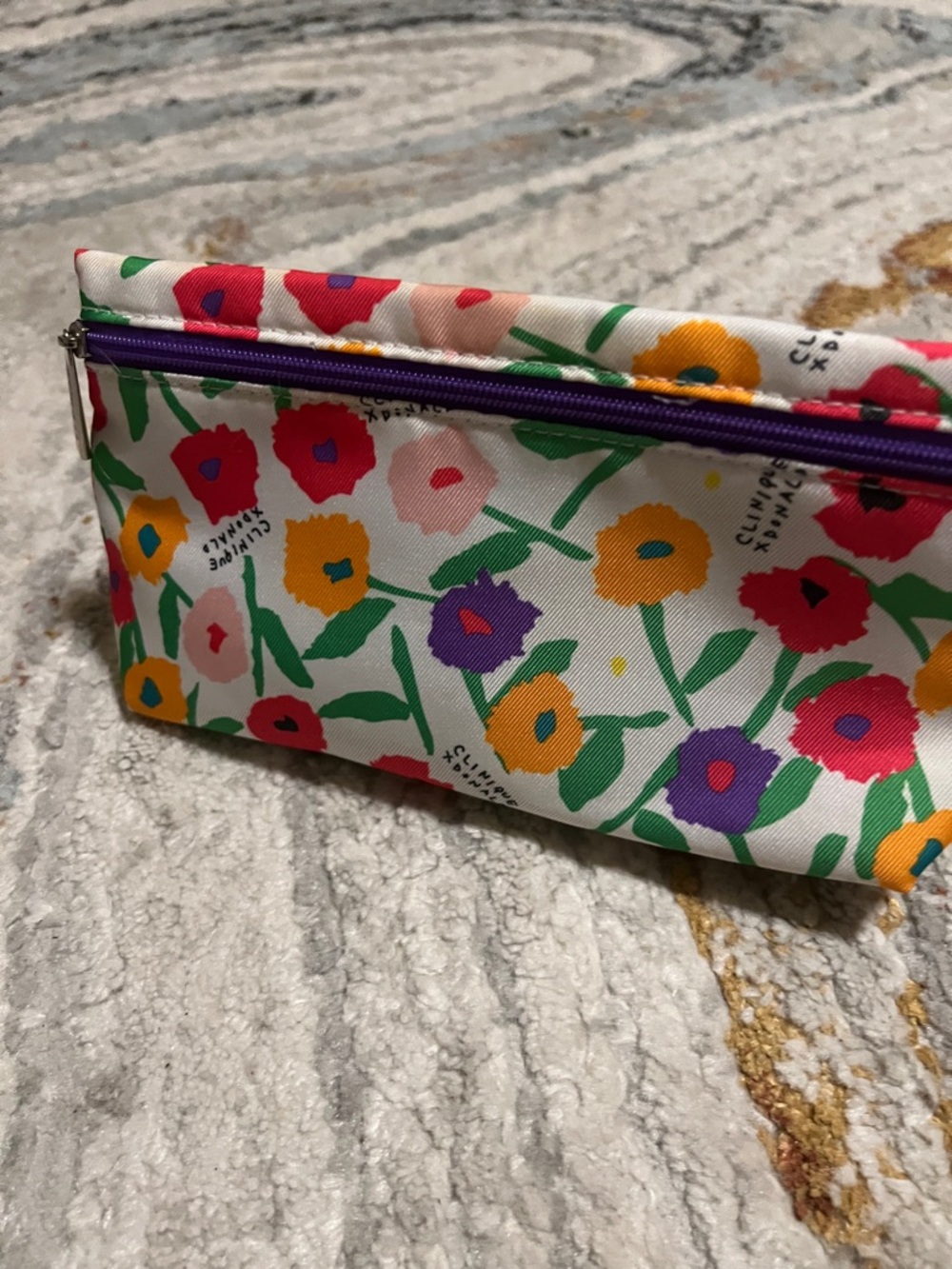 Clinique/Donald Pliner Purple-Lined Floral Cosmetic Pouch.    NEW